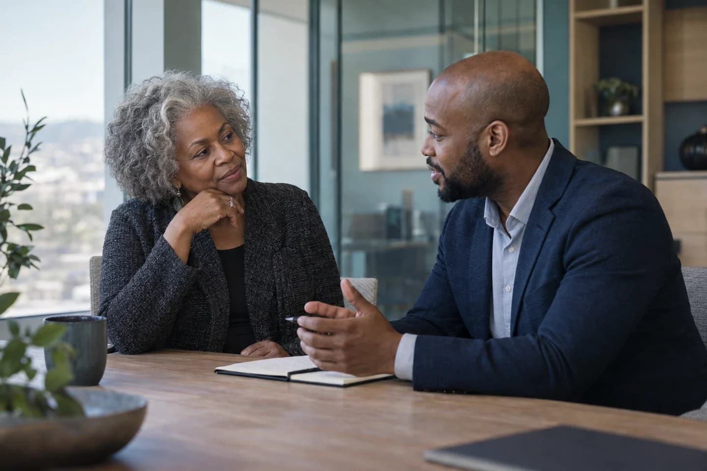 An advisor and an older woman in conversation